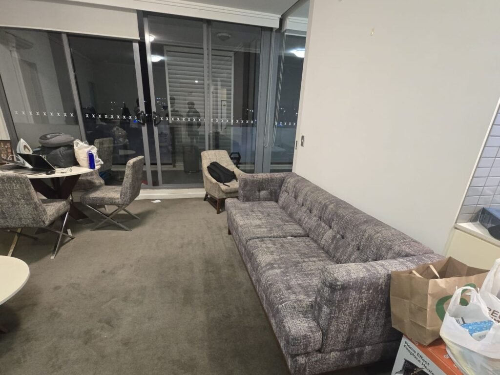 Living room with sofa and dining table, Parramatta shared accommodation